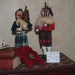 Depiction of the 11th day of Christmas with two pipers