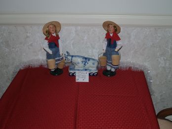 Depiction of the 8th day of Christmas with two maids