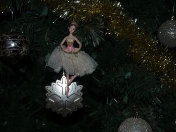 Depiction of the 9th day of Christmas with a lady dancing ornament