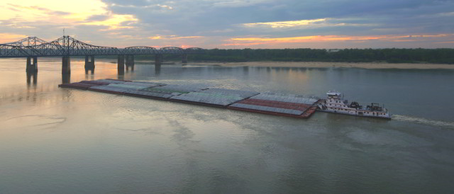 Towboat with barges on Mississippi River.